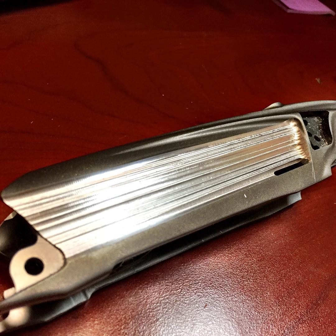 An Empire Vanquish body fresh off the mill, cut into long parallel flutes before anodizing.