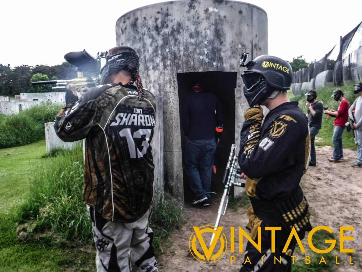 Tony, his name and 13 across his back, fires from beside the concrete silo with a teammate at his side, June 2015.