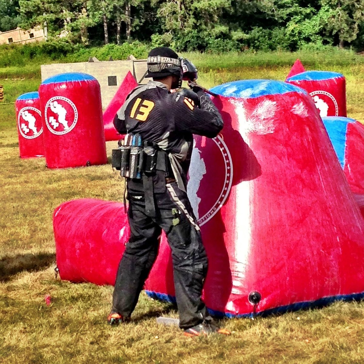 Tony, gold 13 on his back, works the edge of a red inflatable on a bright August day in 2013.