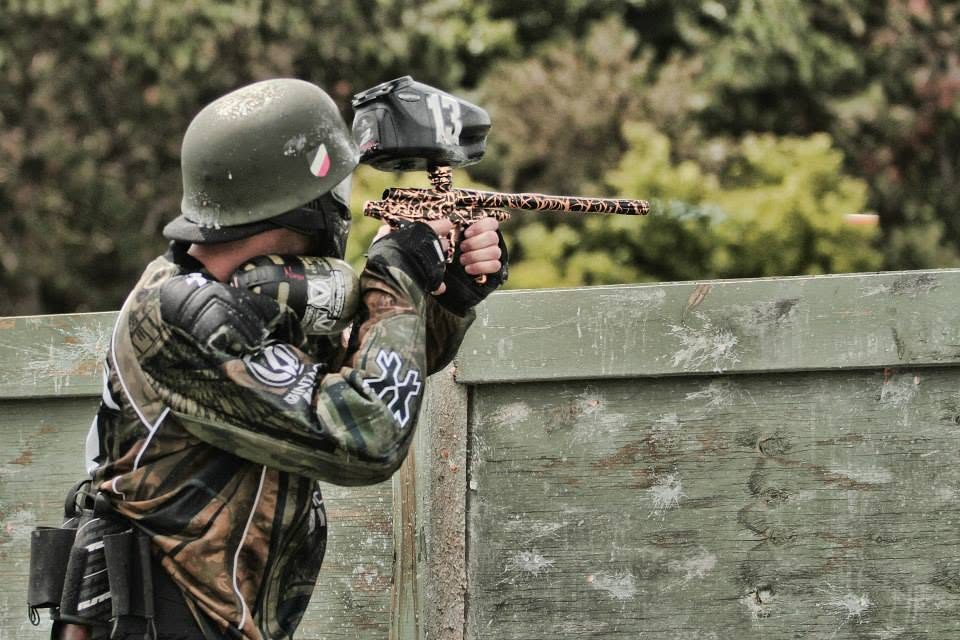 Tony, 13 on his loader and a WWII-style helmet on, aims over a plywood wall at the 2013 Vintage Big Game.
