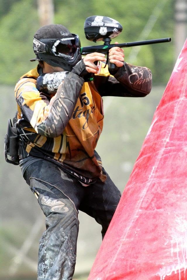Tony, in the gold St. Paul Vintage 05, aims past an inflatable at Vintage Paintball Park, June 2012.