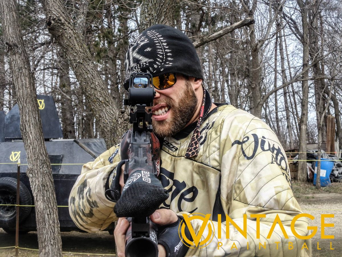 Tony grins behind a holographic sight in the woods at the park, April 2015.