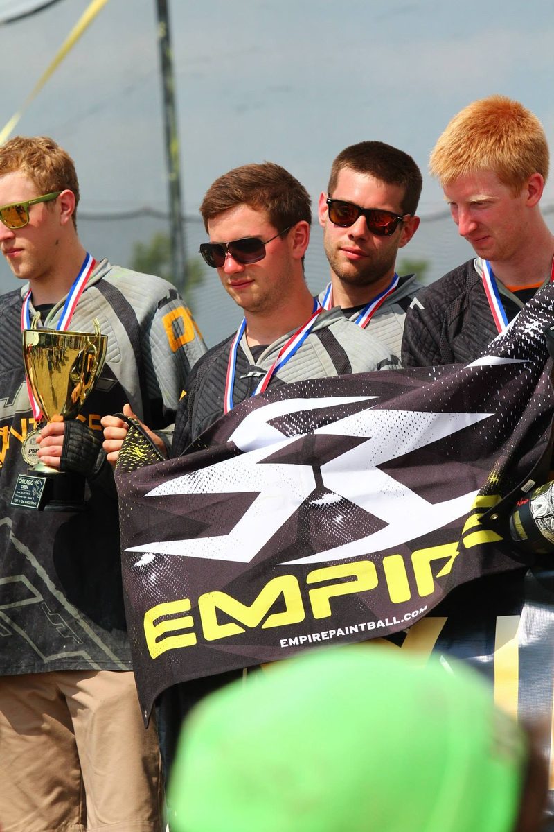 Tony and teammates with medals and the Division 4 trophy on the podium at the 2013 PSP Chicago Open.